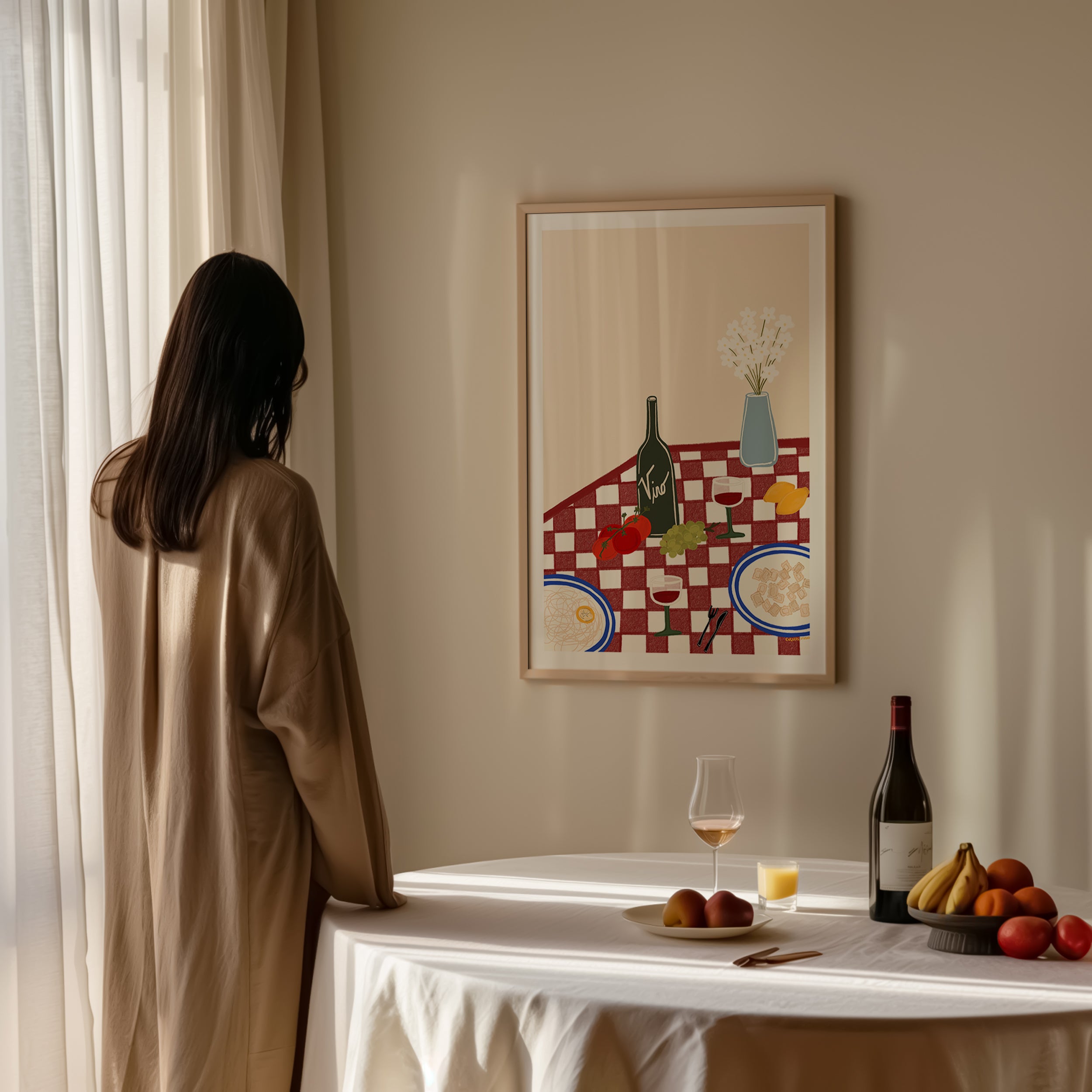 a checkered table set with pasta, wine, citrus, and fresh flowers