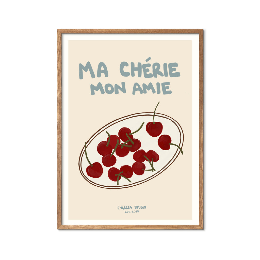 Featuring the French words “Ma Chérie, Mon Amie” in soft blue against a cream background